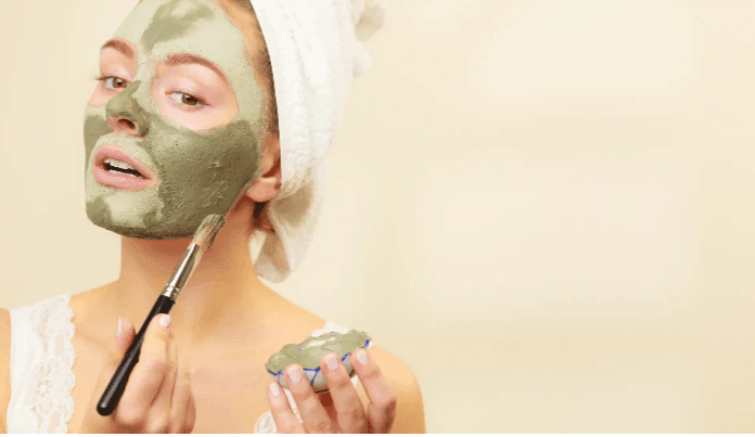 Skincare benefits of glacial clay – woman applying glacial clay mud mask to her face